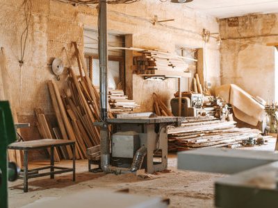 199645530-carpentry-shop-interior-with-wood-and-tools
